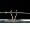 Elegant Japanese sword with a sharp blade and intricately detailed handle.