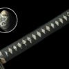 Exquisite Japanese katana showcasing traditional craftsmanship and intricate blade design.